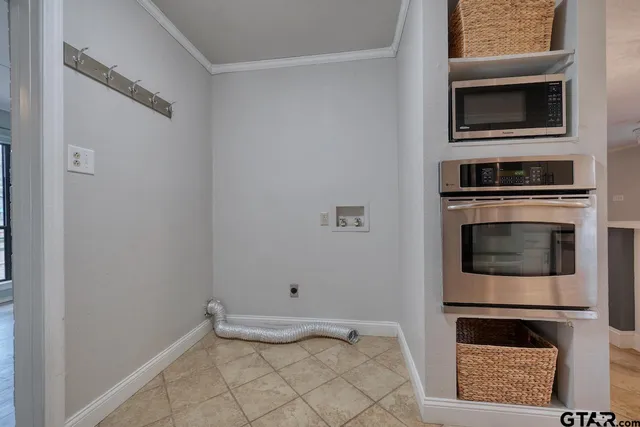a kitchen with a stove and a microwave
