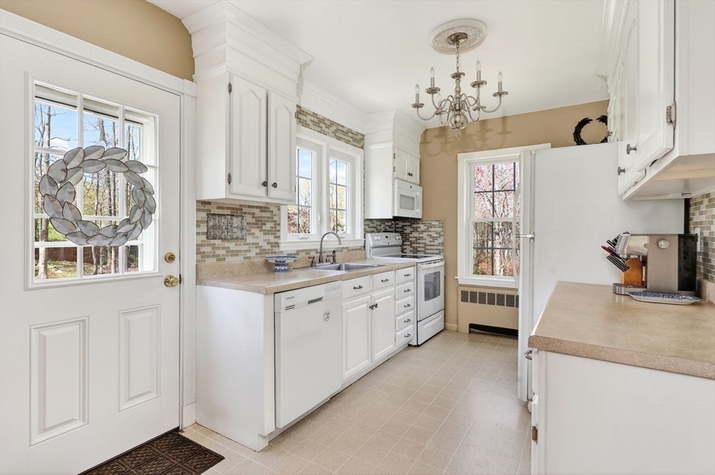 15 Leigh Road Norwell, MA 02061 - Photo 12 of 34 a kitchen that has a lot of white furniture and a window