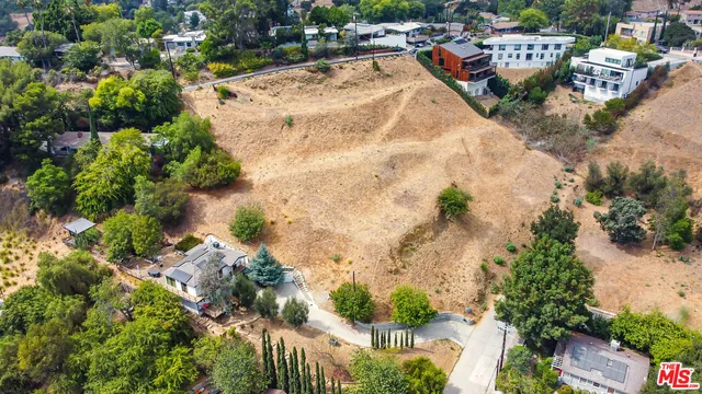 an aerial view of a houses with outdoor space