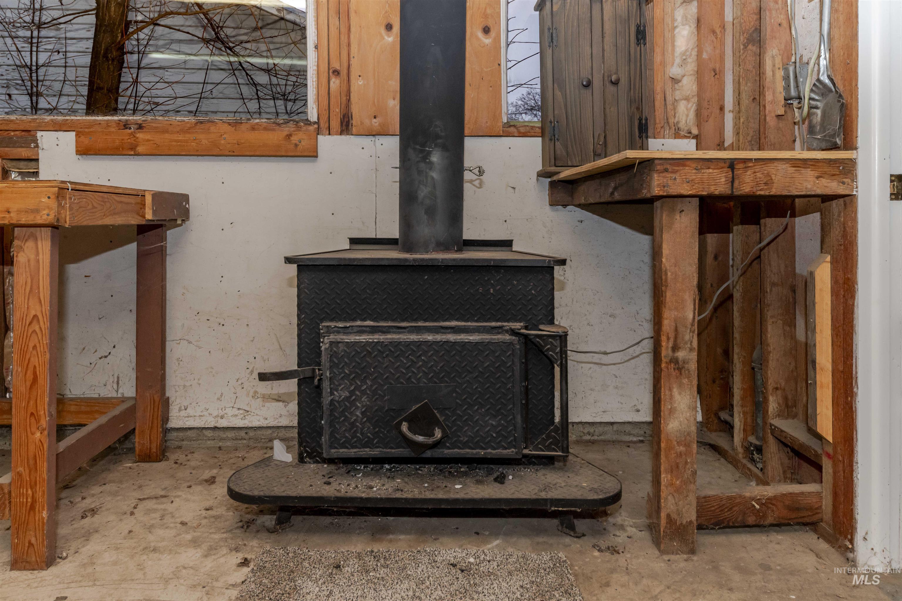 1906 15th Avenue Lewiston, ID 83501 - Photo 17 of 18 Detailed view of a wood stove and unfinished concrete flooring