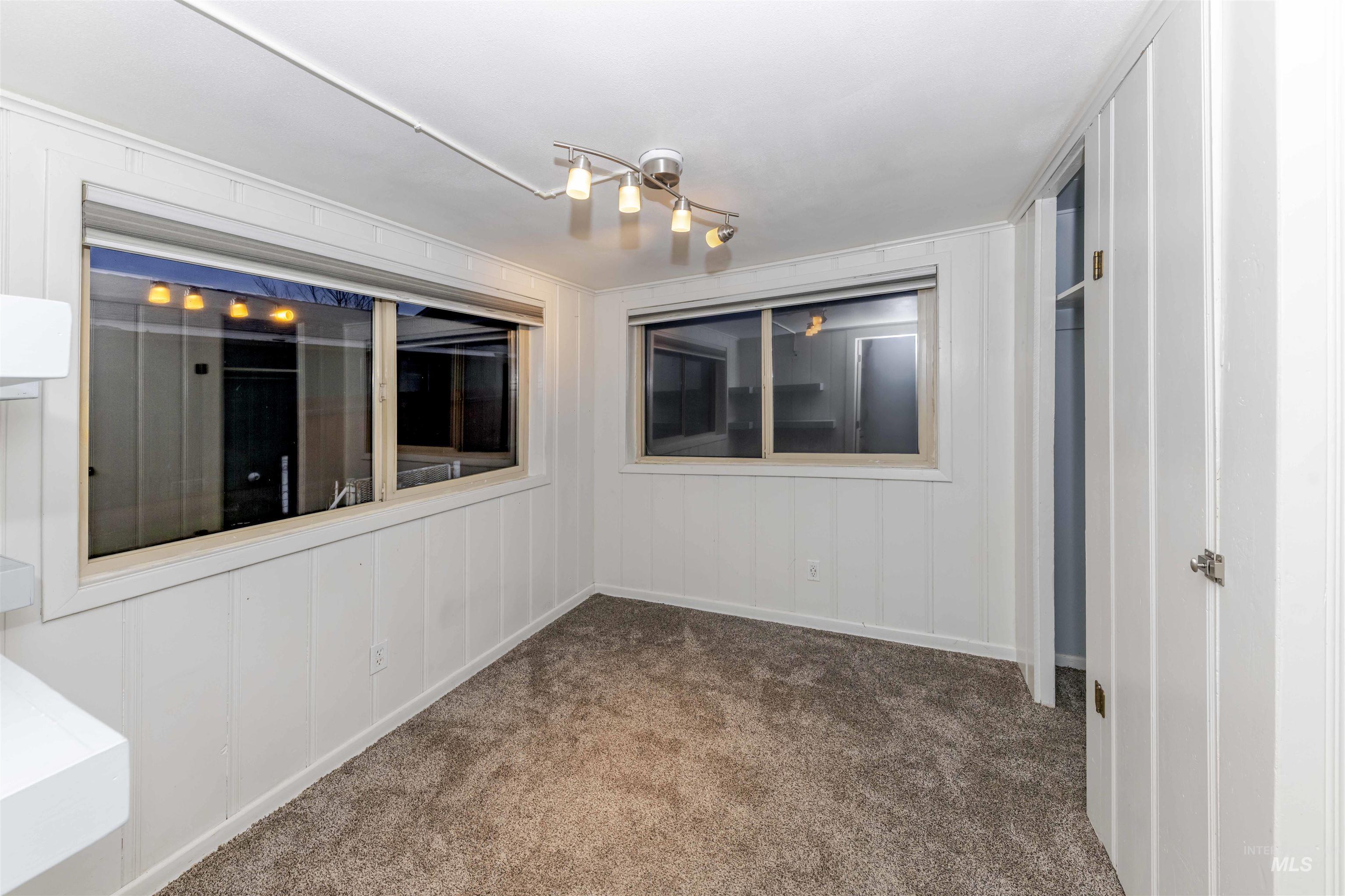 1906 15th Avenue Lewiston, ID 83501 - Photo 6 of 18 Bedroom featuring carpet and a decorative wall