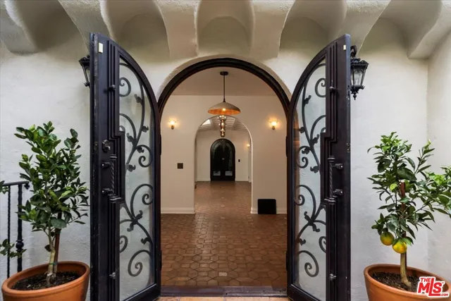 a kitchen with granite countertop a sink stove and cabinets