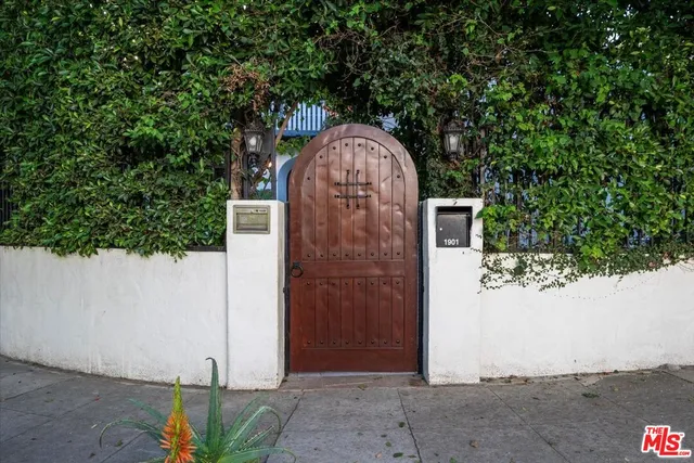 a stone house with trees in front of it