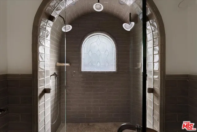 a view of wooden floor and windows in a room