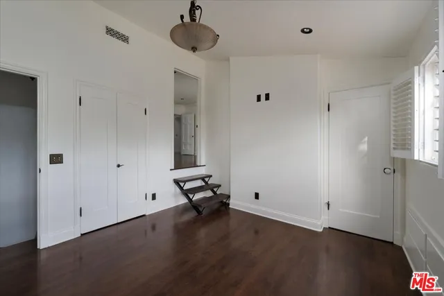 a bathroom with a granite countertop sink a shower and a mirror