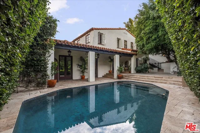 a view of a porch with potted plants