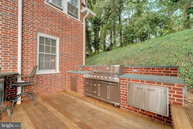 a view of a livingroom with furniture stairs and wooden floor