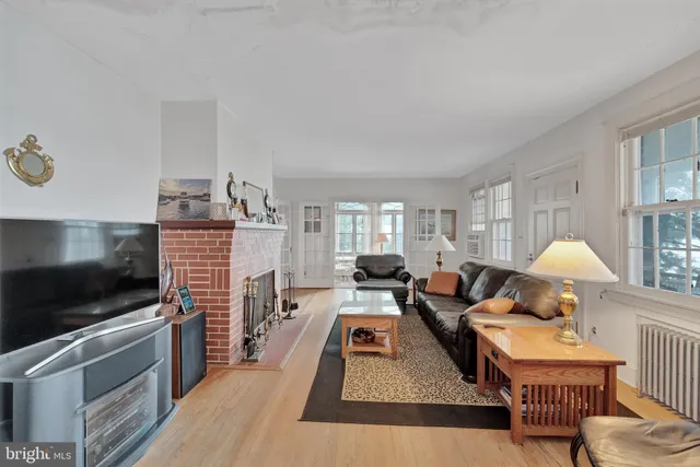 a kitchen with stainless steel appliances a sink a stove a refrigerator and cabinets