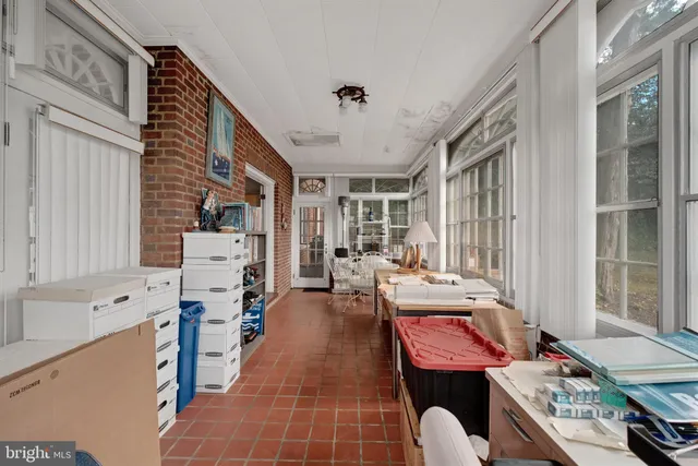 a bedroom with a bed and a desk