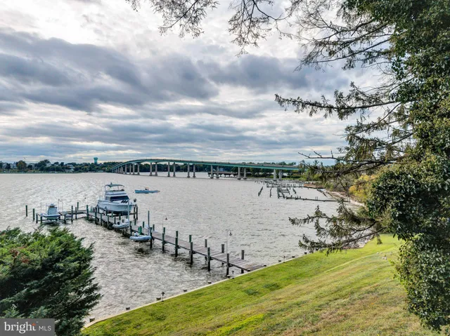 a view of a patio with table and chairs and potted plants
