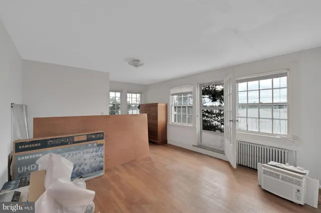 a view of a livingroom with furniture and a floor to ceiling window