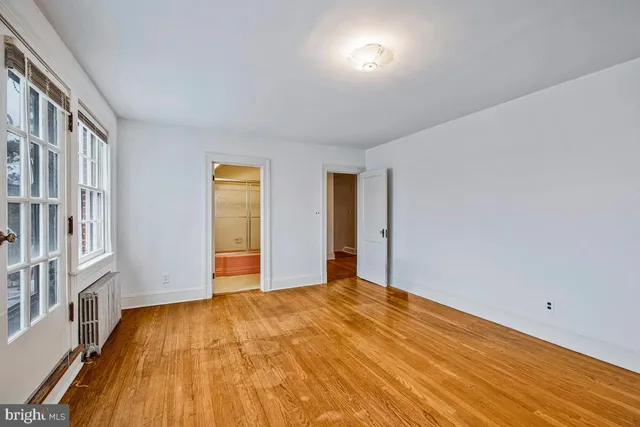 a bathroom with a tub shower and sink
