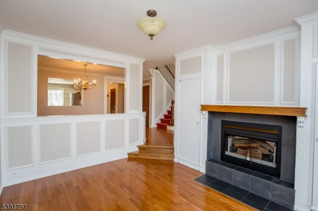 a view of an empty room and fire place