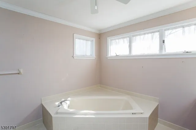 a white bath tub sitting in a bathroom