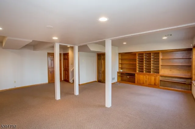 an empty room with a chair and dryer