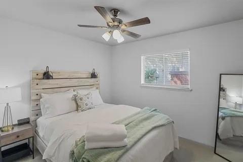 3130 Barton Road Carrollton, TX 75007 - Photo 11 of 16 a bedroom with a bed and a table