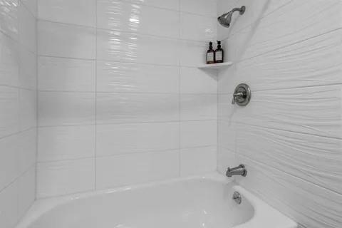 3130 Barton Road Carrollton, TX 75007 - Photo 13 of 16 a bathroom with a bathtub