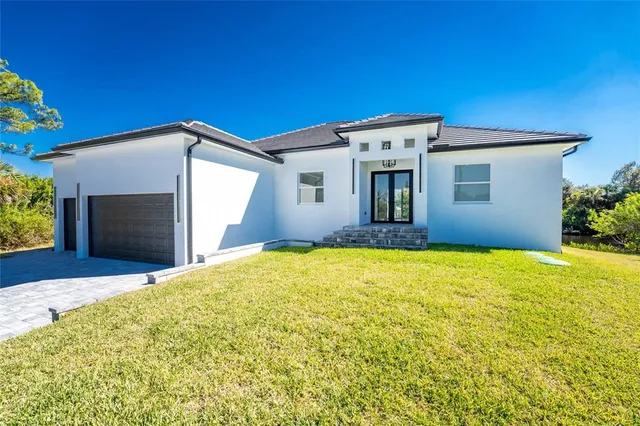 a front view of a house with yard