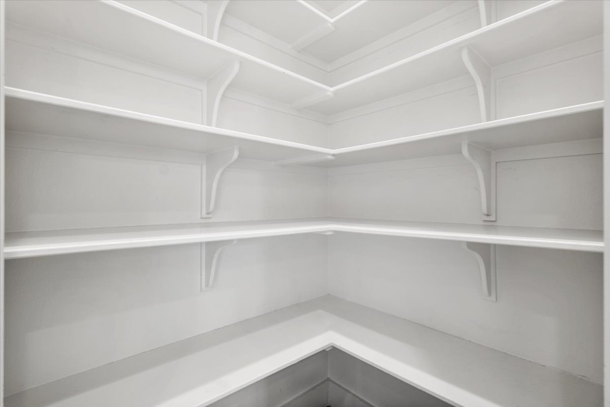 913 Stobaugh Street, Unit B Austin, TX 78757 - Photo 20 of 40 Ample, neatly built-in shelving provides generous pantry storage solutions for any household.