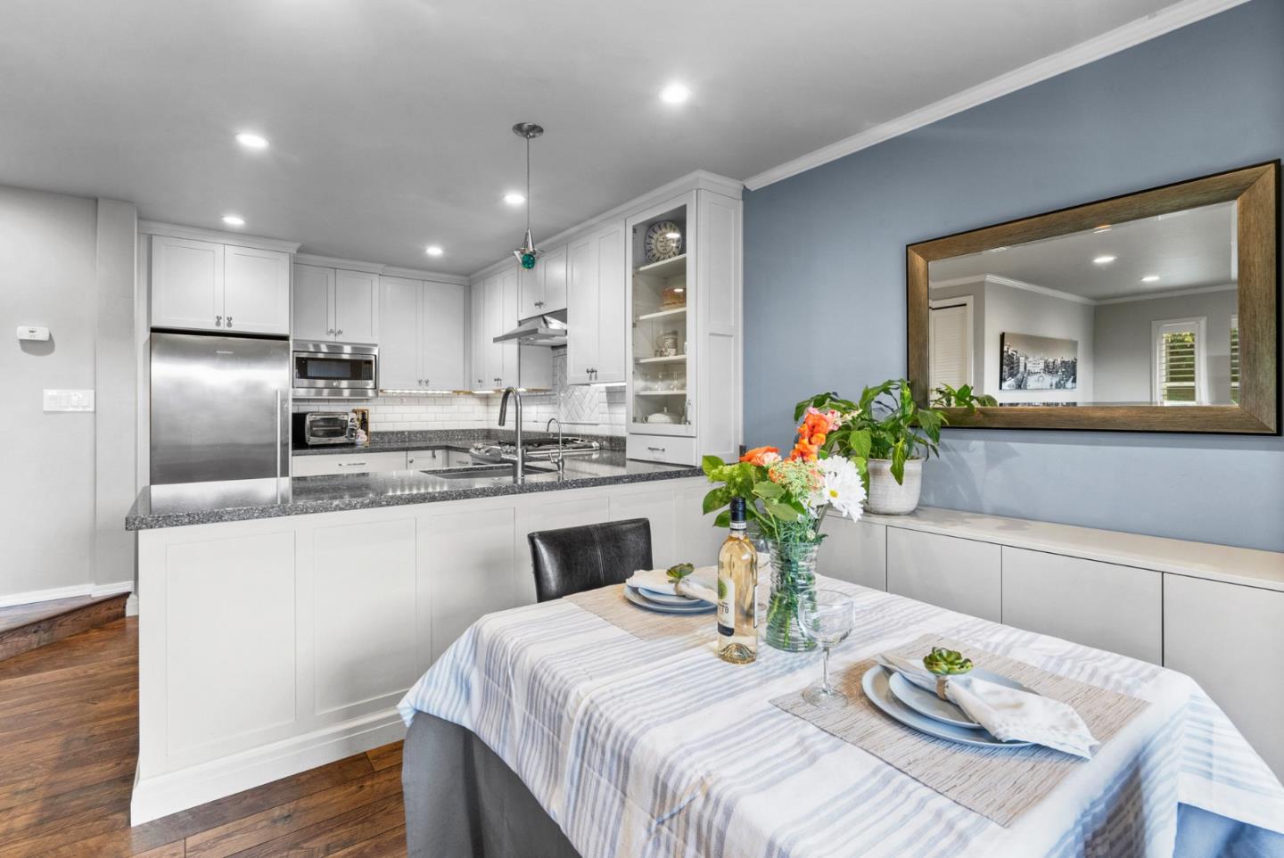 3071 Arlington Drive Aptos, CA 95003 - Photo 11 of 54 a kitchen with sink refrigerator dining table and chairs