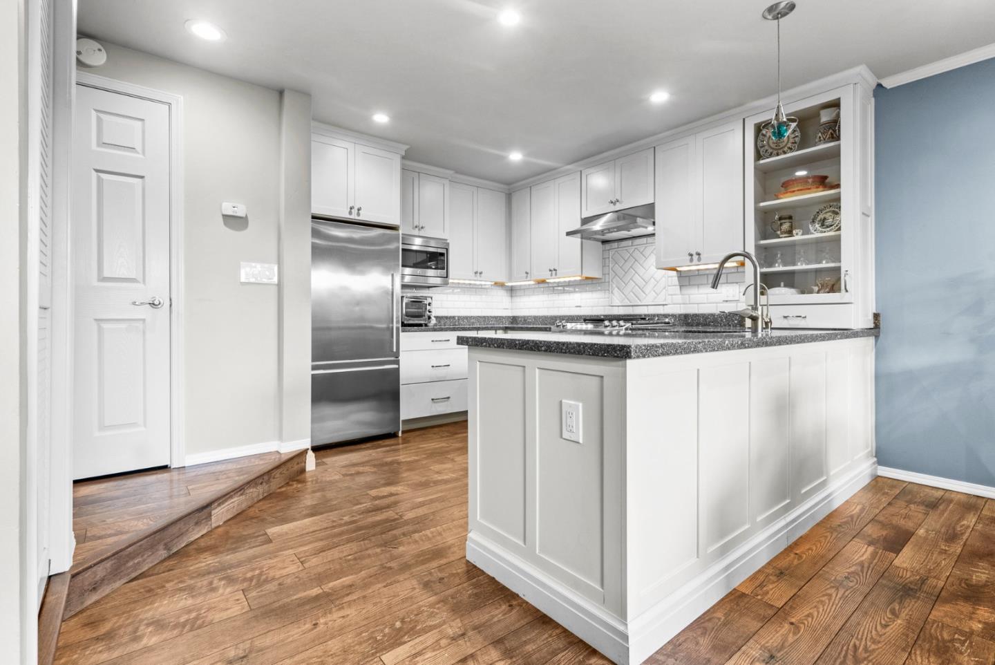 3071 Arlington Drive Aptos, CA 95003 - Photo 12 of 54 a kitchen with stainless steel appliances granite countertop a sink and a refrigerator