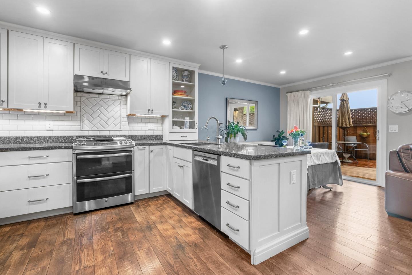 3071 Arlington Drive Aptos, CA 95003 - Photo 13 of 54 a kitchen with stainless steel appliances granite countertop a stove and cabinets