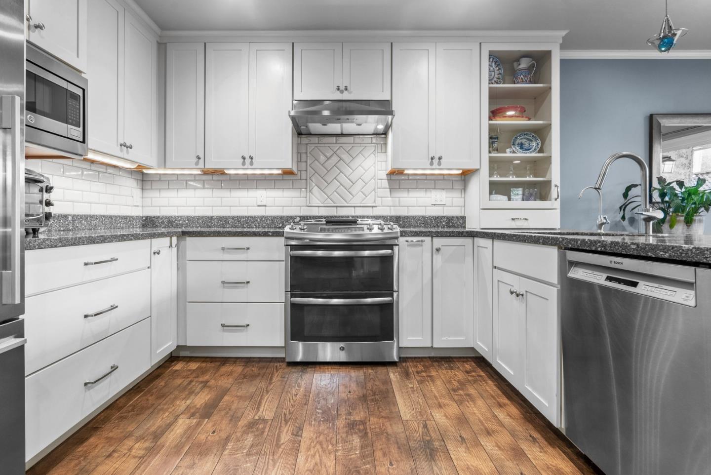 3071 Arlington Drive Aptos, CA 95003 - Photo 14 of 54 a kitchen with stainless steel appliances granite countertop a sink and cabinets