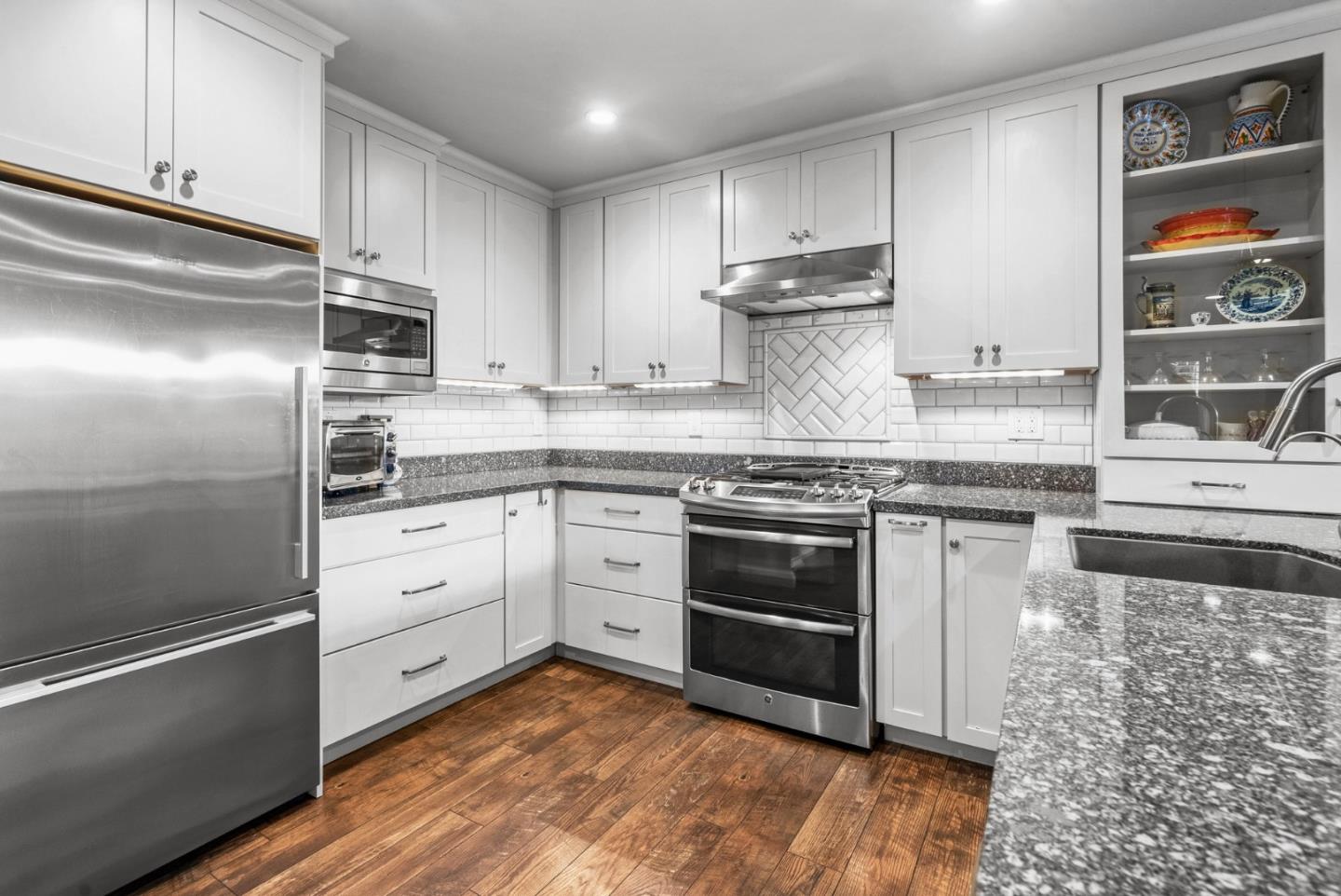 3071 Arlington Drive Aptos, CA 95003 - Photo 15 of 54 a kitchen with stainless steel appliances granite countertop a stove a sink and a refrigerator