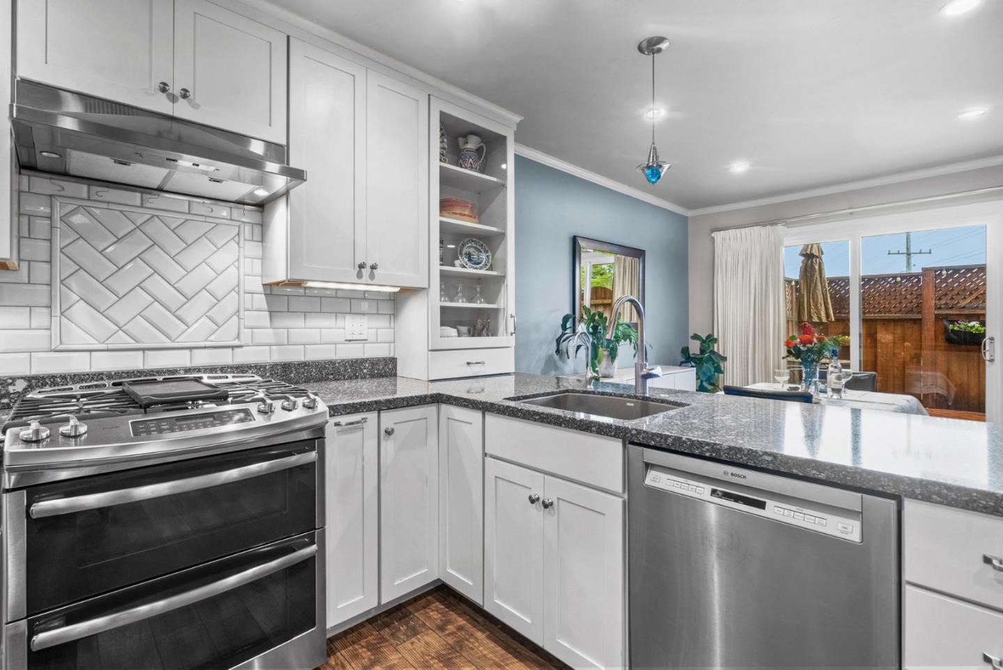 3071 Arlington Drive Aptos, CA 95003 - Photo 17 of 54 a kitchen with stainless steel appliances granite countertop a stove and a sink