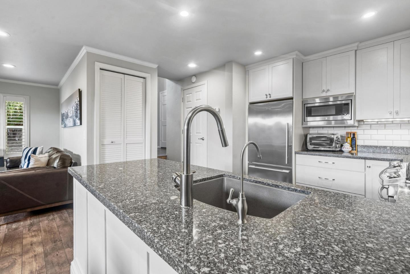 3071 Arlington Drive Aptos, CA 95003 - Photo 19 of 54 a kitchen with granite countertop a sink a counter top space appliances and cabinets