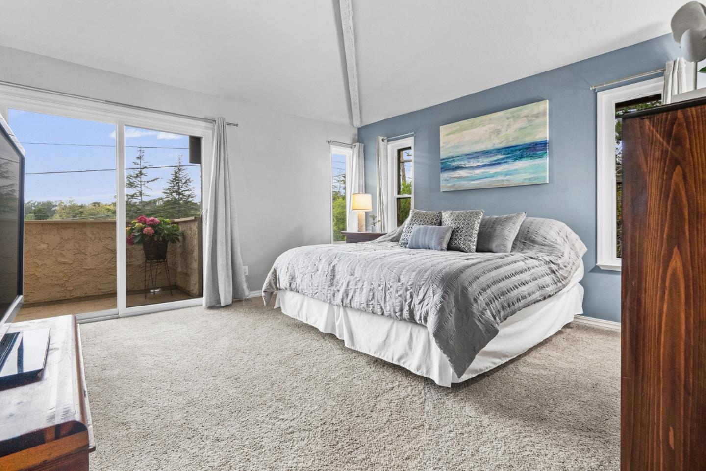 3071 Arlington Drive Aptos, CA 95003 - Photo 20 of 54 a bedroom with a large bed and a painting on the wall