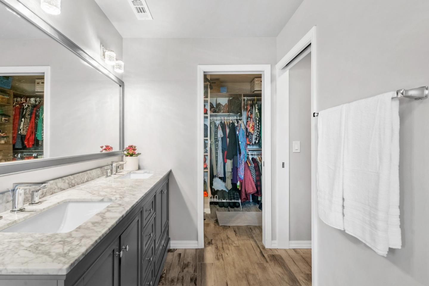 3071 Arlington Drive Aptos, CA 95003 - Photo 24 of 54 a bathroom with a granite countertop sink a mirror and a shower