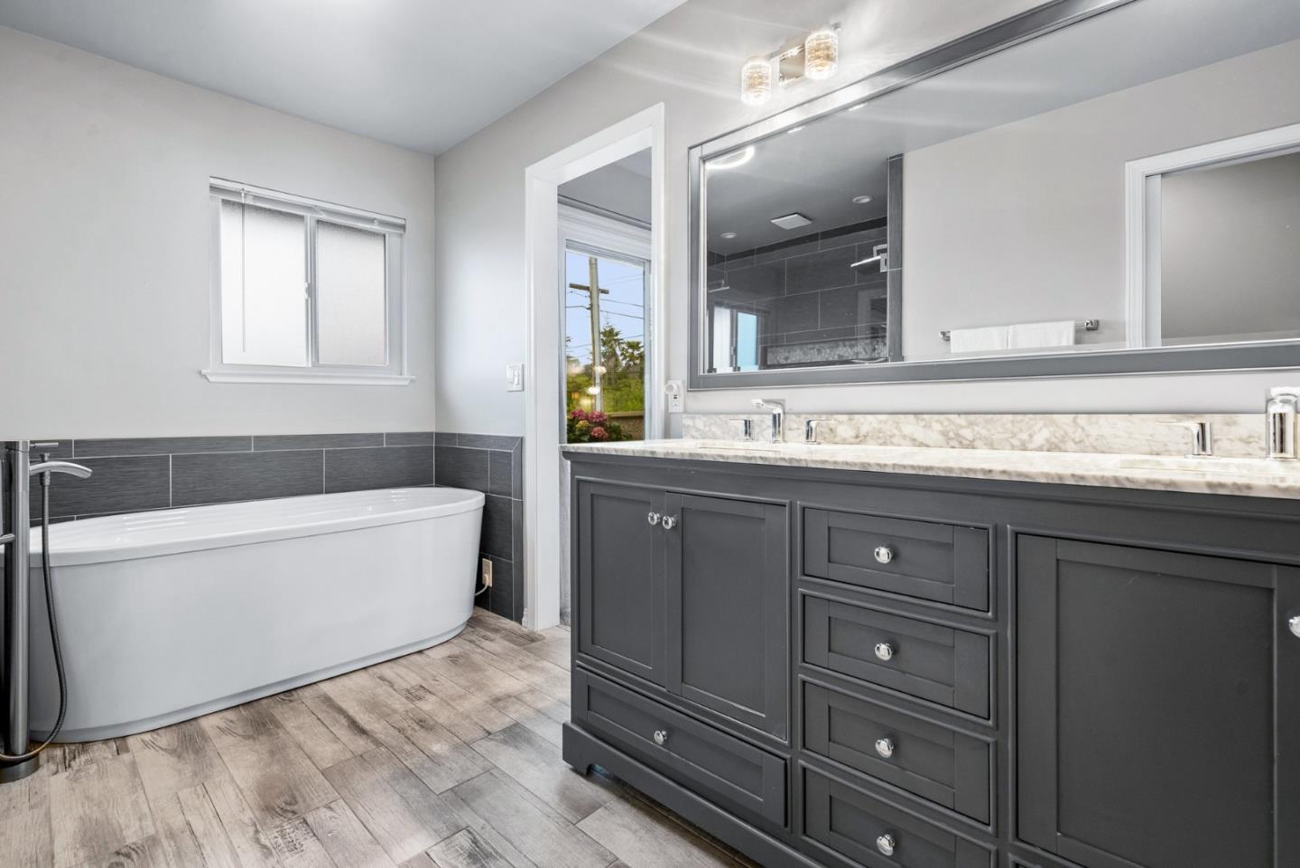 3071 Arlington Drive Aptos, CA 95003 - Photo 26 of 54 a bathroom with a tub sink and mirror