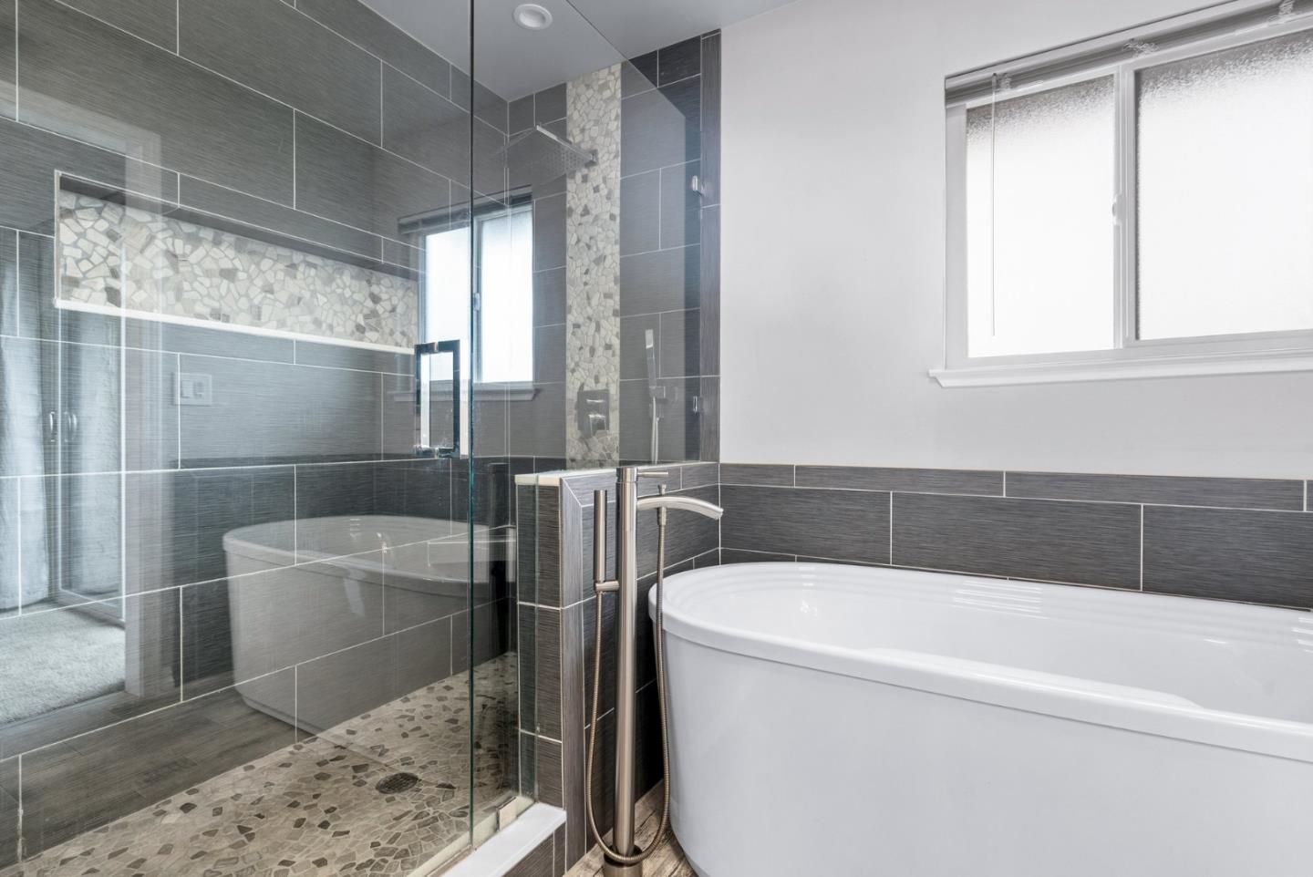 3071 Arlington Drive Aptos, CA 95003 - Photo 27 of 54 a bathroom with a bathtub and a shower