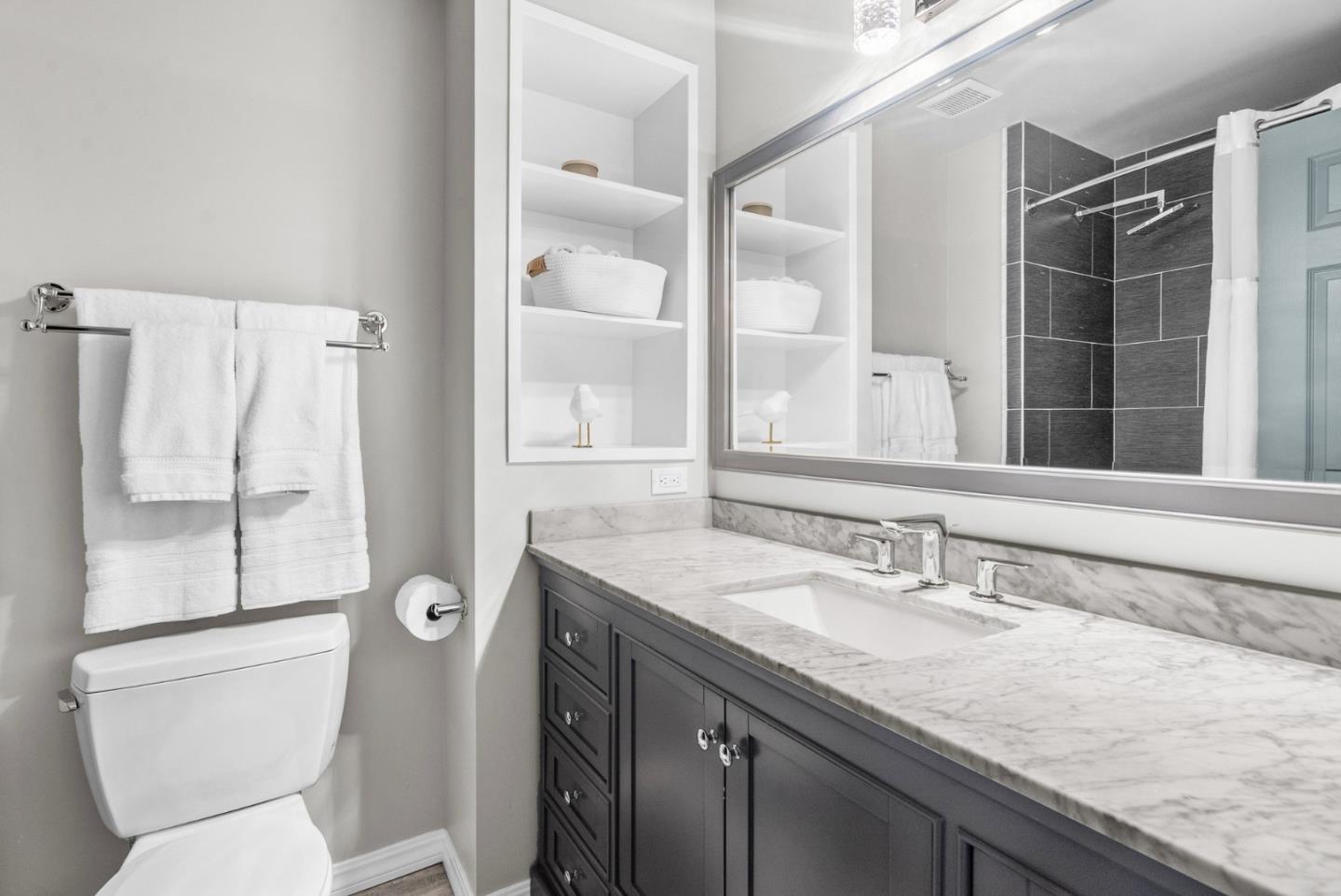 3071 Arlington Drive Aptos, CA 95003 - Photo 31 of 54 a bathroom with a granite countertop sink toilet and shower