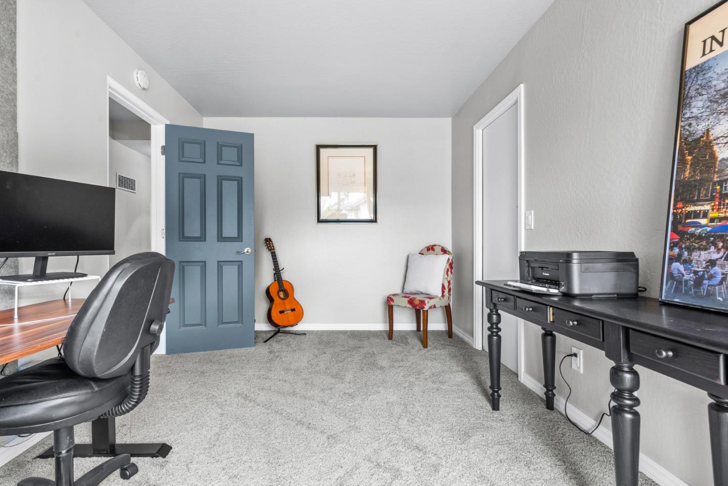3071 Arlington Drive Aptos, CA 95003 - Photo 40 of 54 a view of a workspace with furniture and a flat screen tv