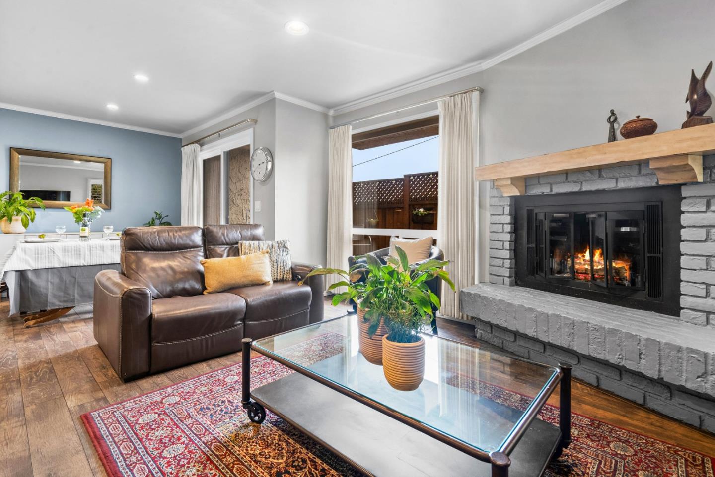 3071 Arlington Drive Aptos, CA 95003 - Photo 6 of 54 a living room with furniture potted plant and a fireplace