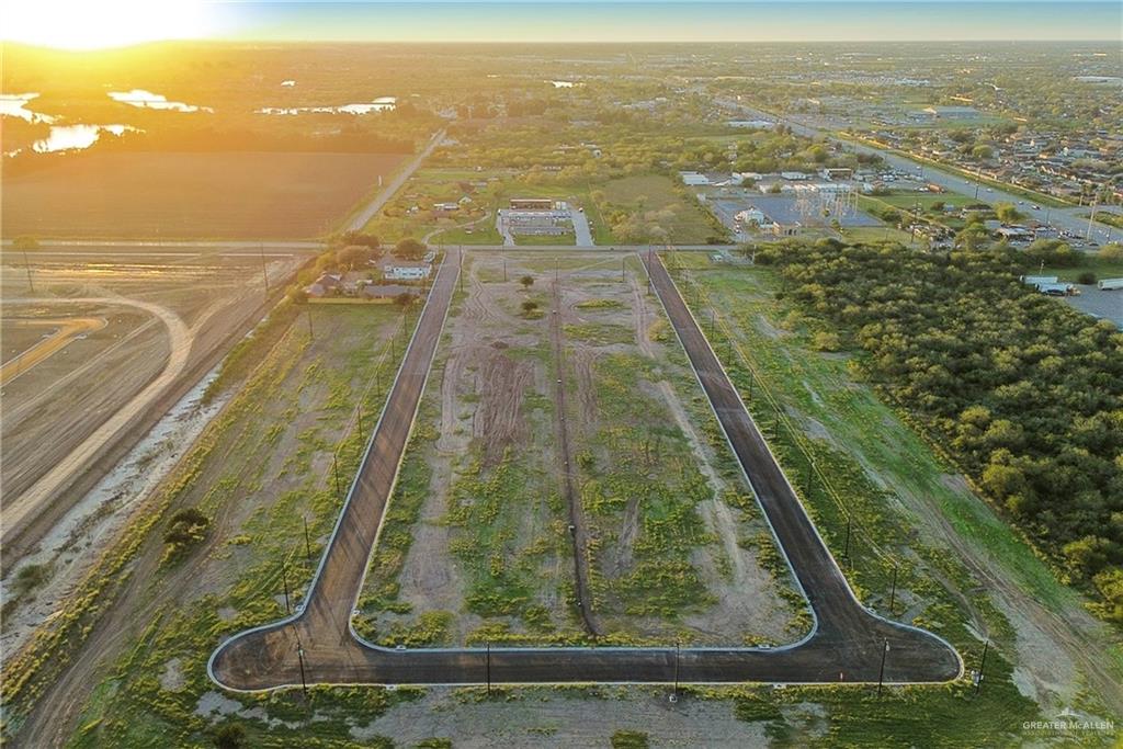 38438 Hicks Road Brownsville, TX 78521 - Photo 3 of 7 an aerial view of residential houses with outdoor space