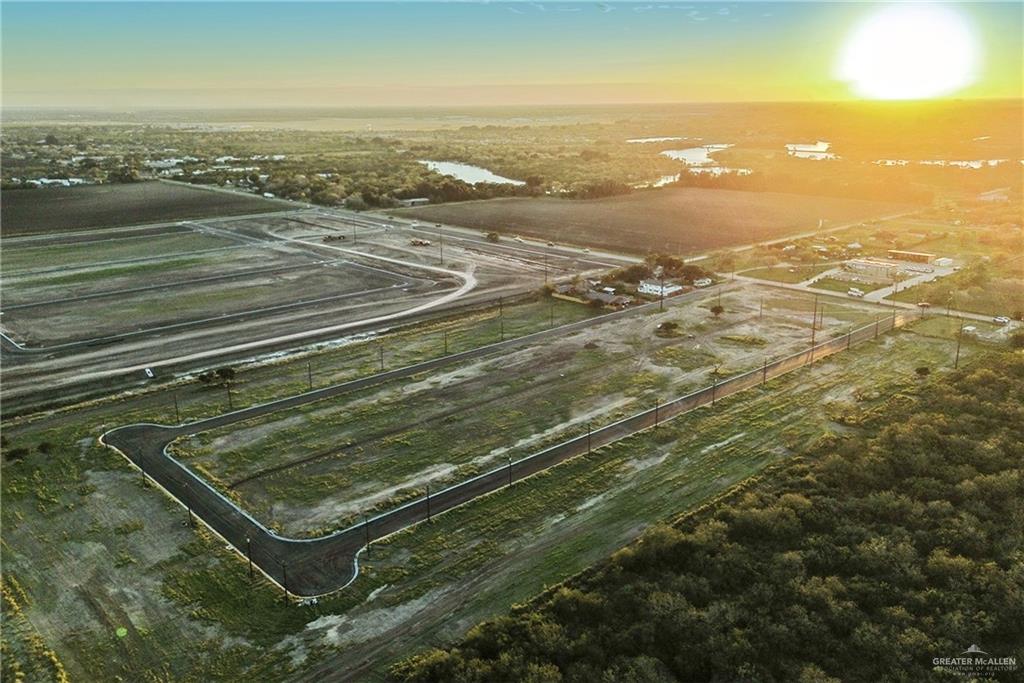 38438 Hicks Road Brownsville, TX 78521 - Photo 4 of 7 an aerial view of residential houses with outdoor space