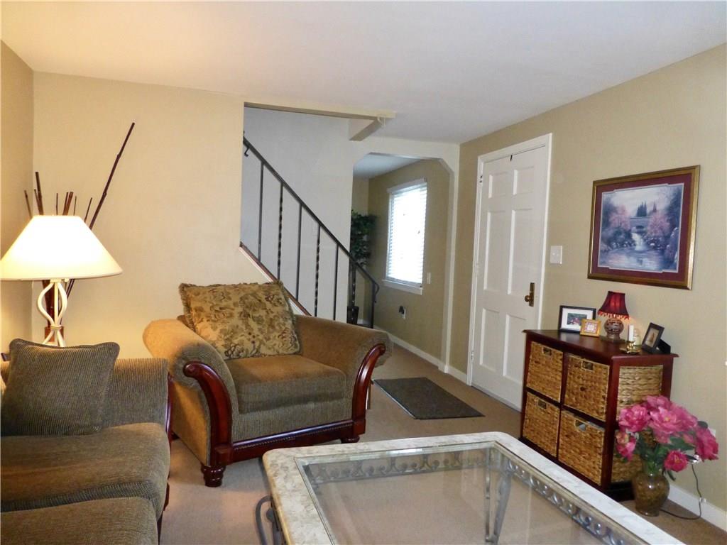 Front door and stairs from living room
