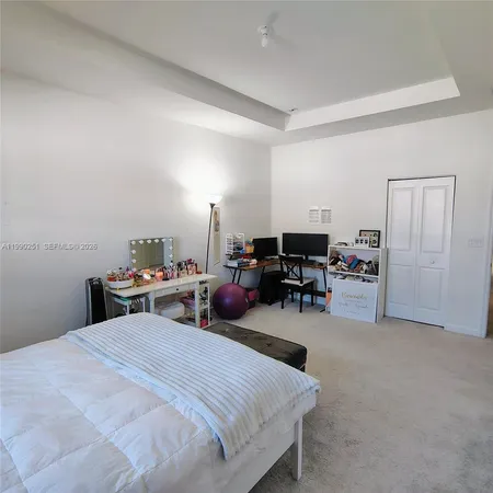 a bedroom with furniture and a bed