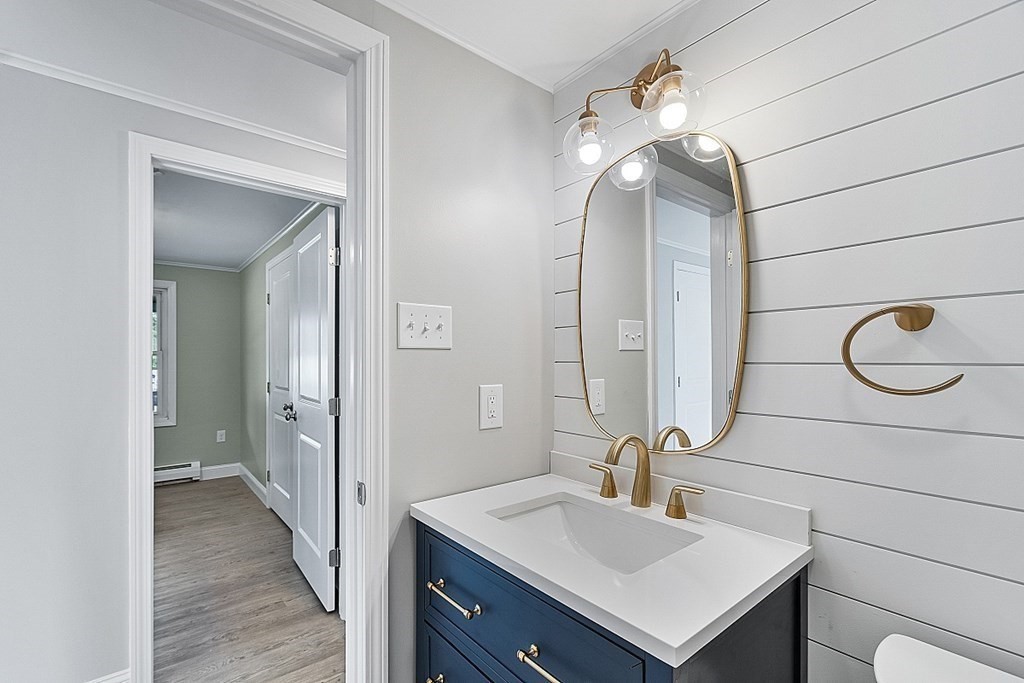 162 Memory Lane Orange, MA 01364 - Photo 25 of 41 a bathroom with a sink vanity and a mirror