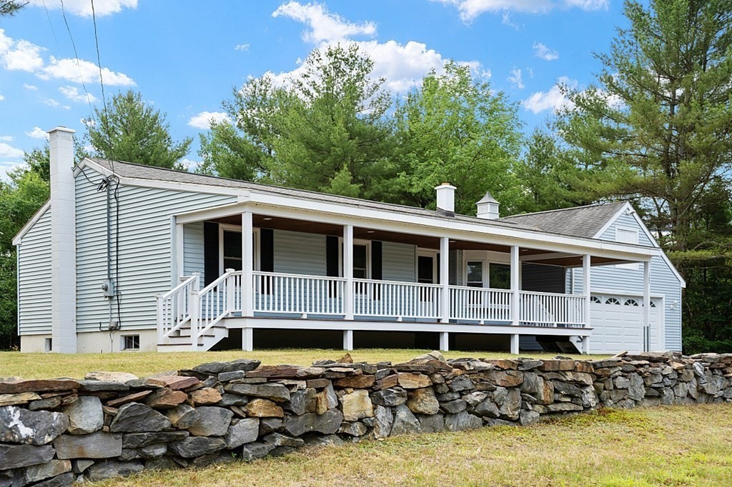 162 Memory Lane Orange, MA 01364 - Photo 4 of 41 a front view of a house with a yard