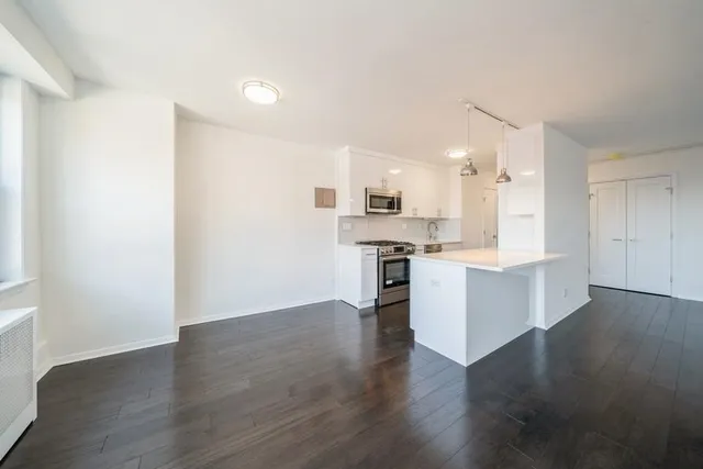 a view of kitchen with wooden floor