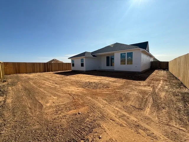 a big house with a large tree in front of it