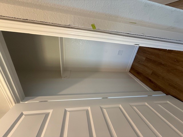 7802 Redbud Road Navasota, TX 77868 - Photo 18 of 24 a view of walk in closet with wooden floor