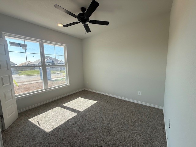 7802 Redbud Road Navasota, TX 77868 - Photo 2 of 24 an empty room with a window and a fan