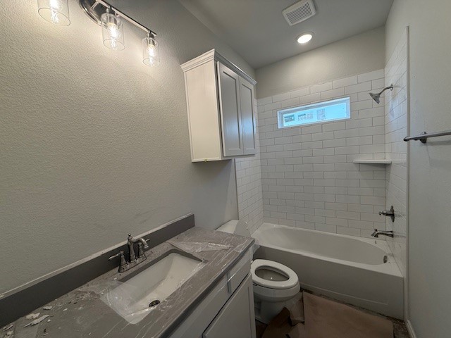 7802 Redbud Road Navasota, TX 77868 - Photo 4 of 24 a bathroom with a sink a toilet a mirror and bathtub
