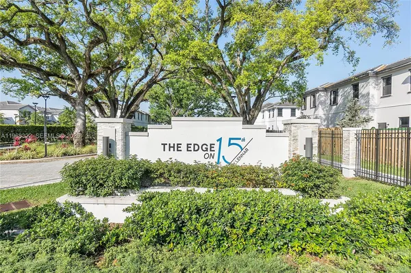 a view of street with houses and trees