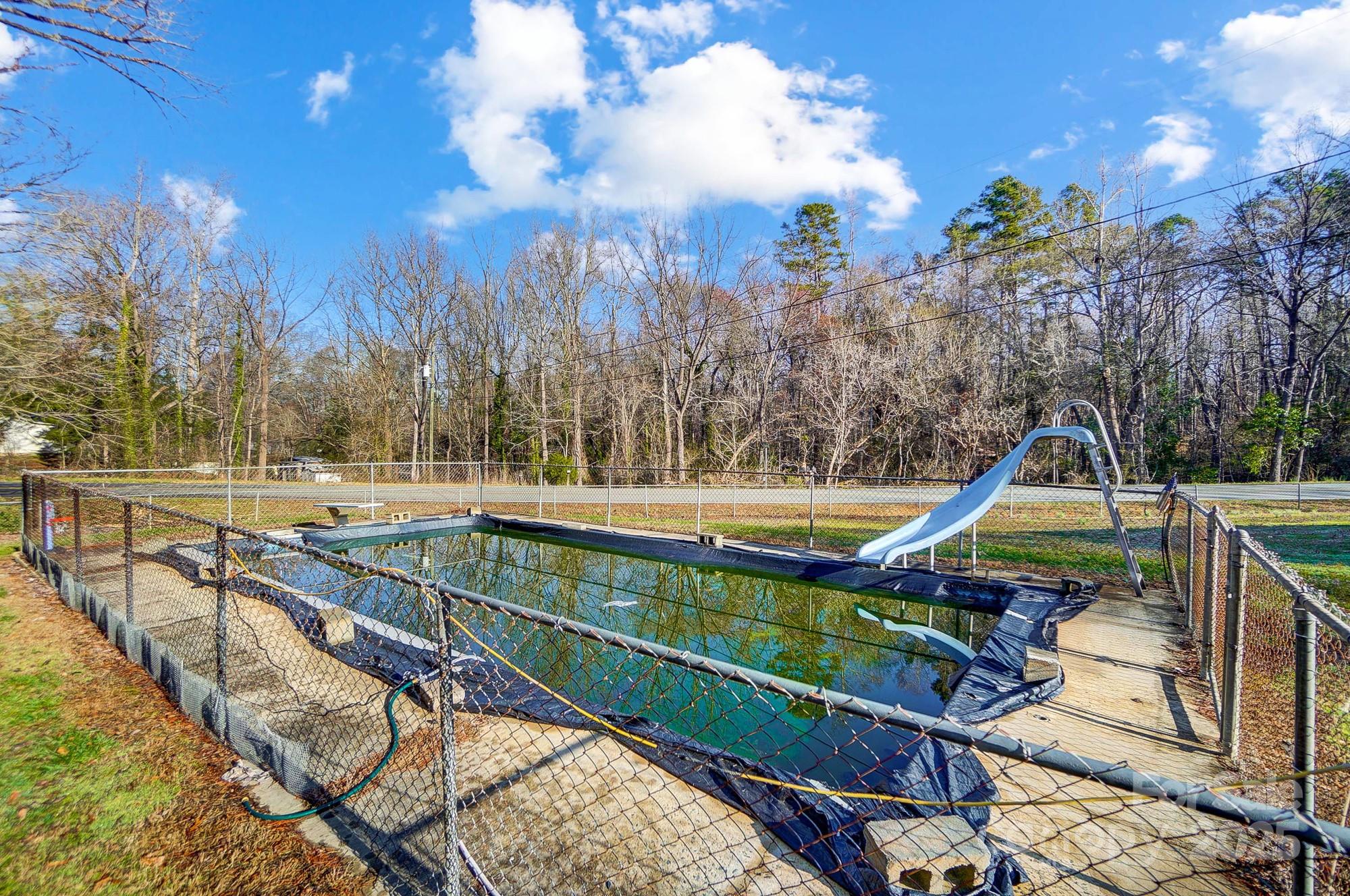 455 Pinhook Loop Road Gastonia, NC 28056 - Photo 11 of 15 a view of a swimming pool with a patio and a yard